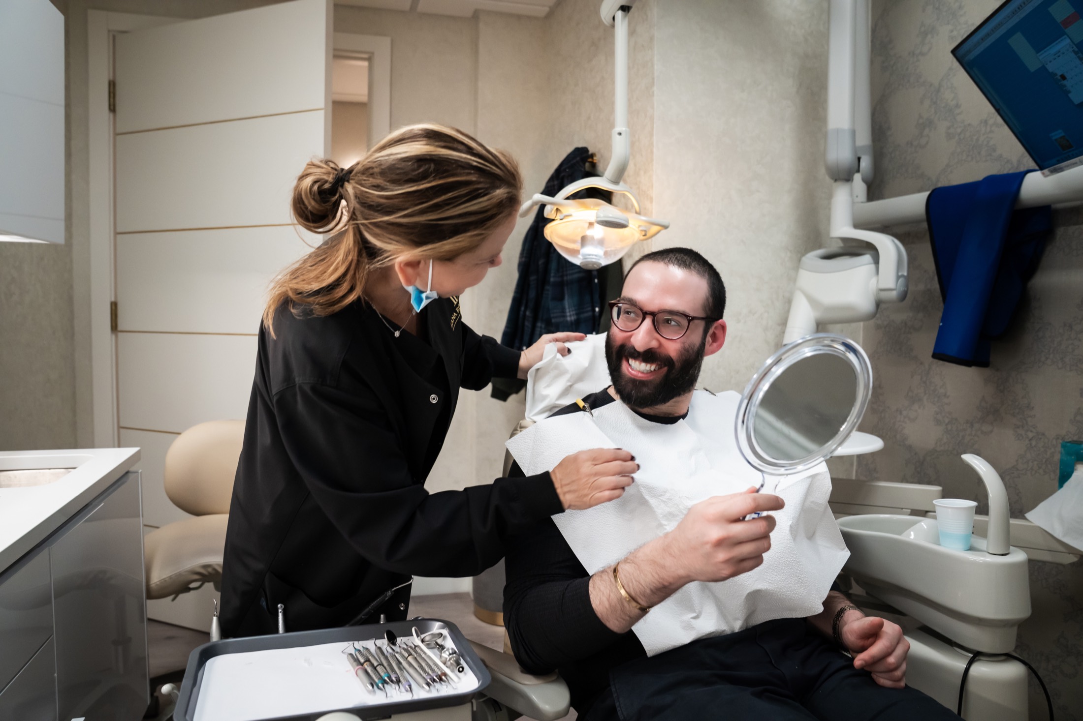 Dr. Rozenberg with a happy patient
